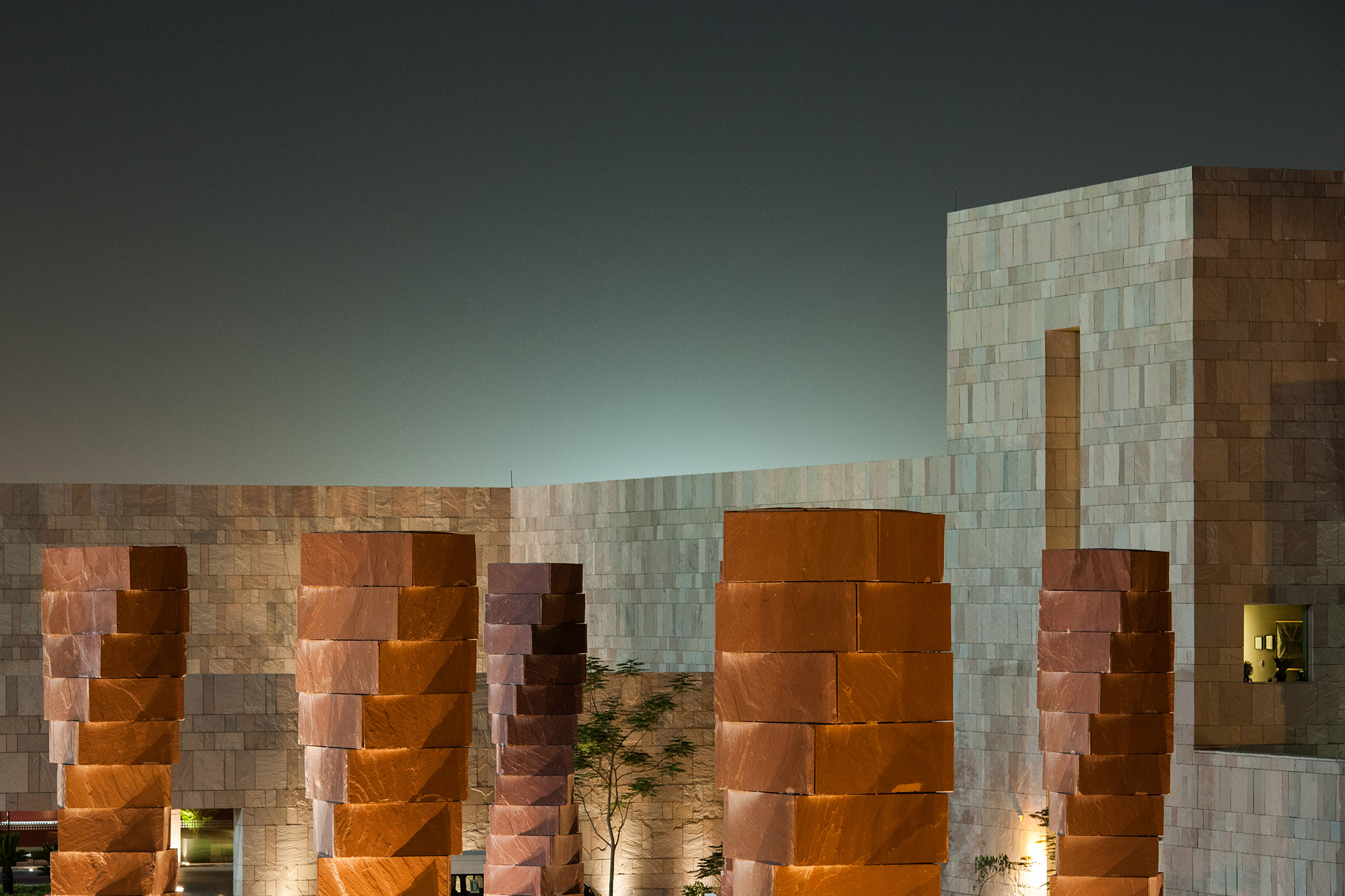 Iconic pillars in front of the GU-Q building, taken at night