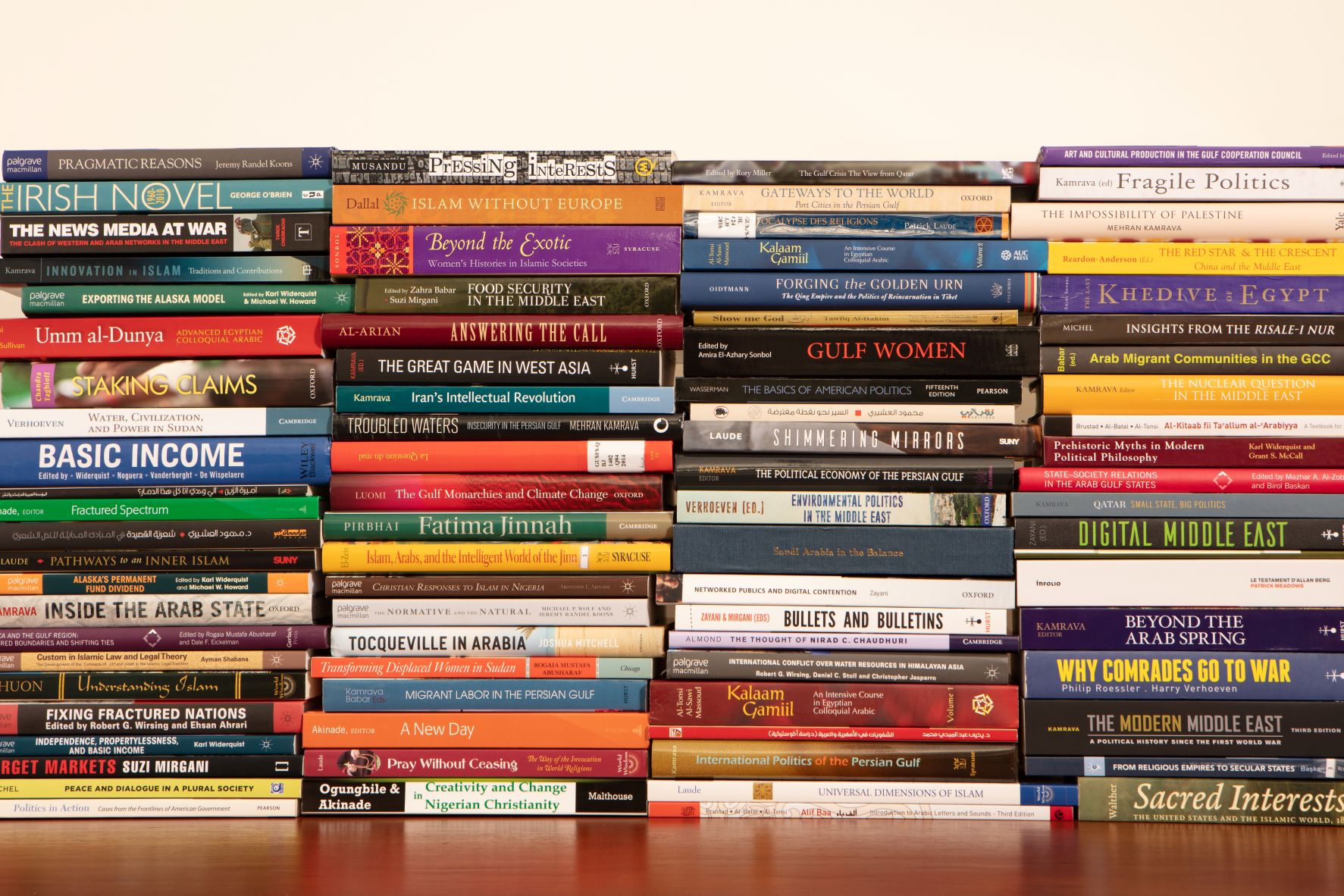 Multiple stacks of books on a table